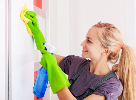 Office cleaning team preparing a workspace in Ealing