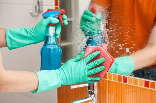 Cleaner starting a safe cleaning task with protective equipment