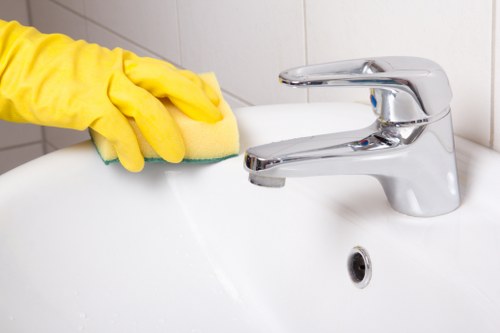 Local sofa cleaner treating stains on a living room sofa