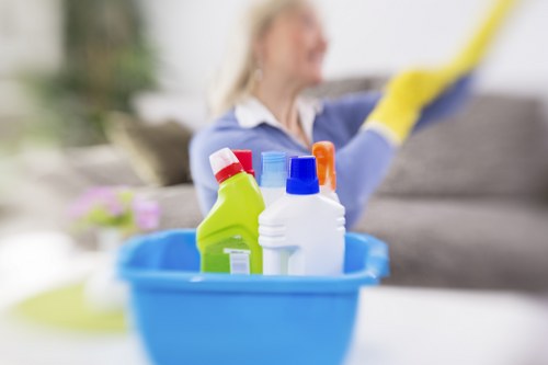 Cleaning high-touch surfaces in a modern apartment during a move out clean