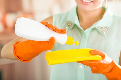 Cleaning kitchen surfaces and cabinets after builders work in Ealing